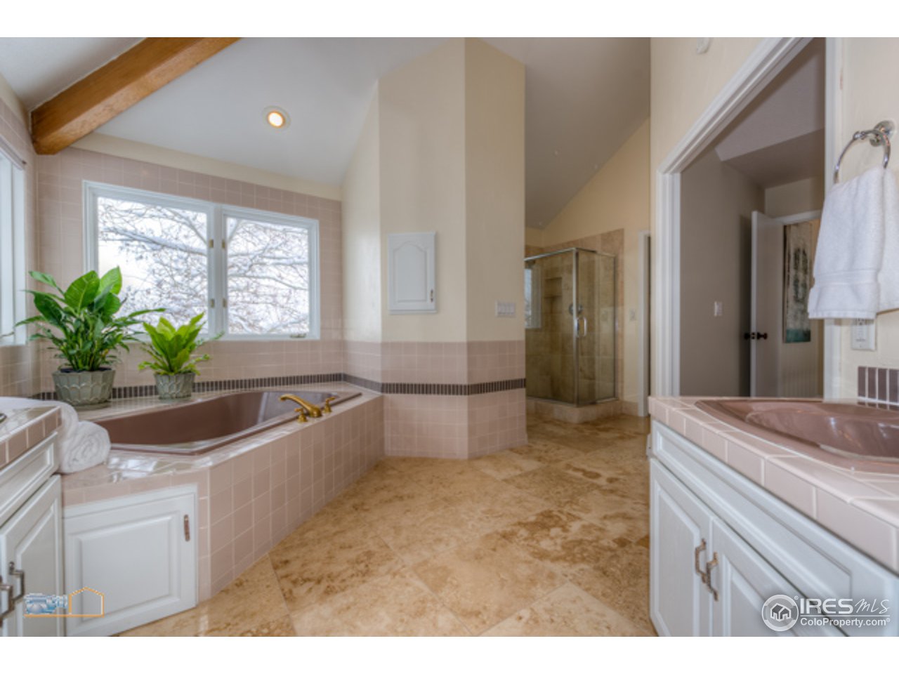 4669 Apple Way Boulder, CO 80301 - Photo 18 of 25 a bathroom with sink bathtub and window