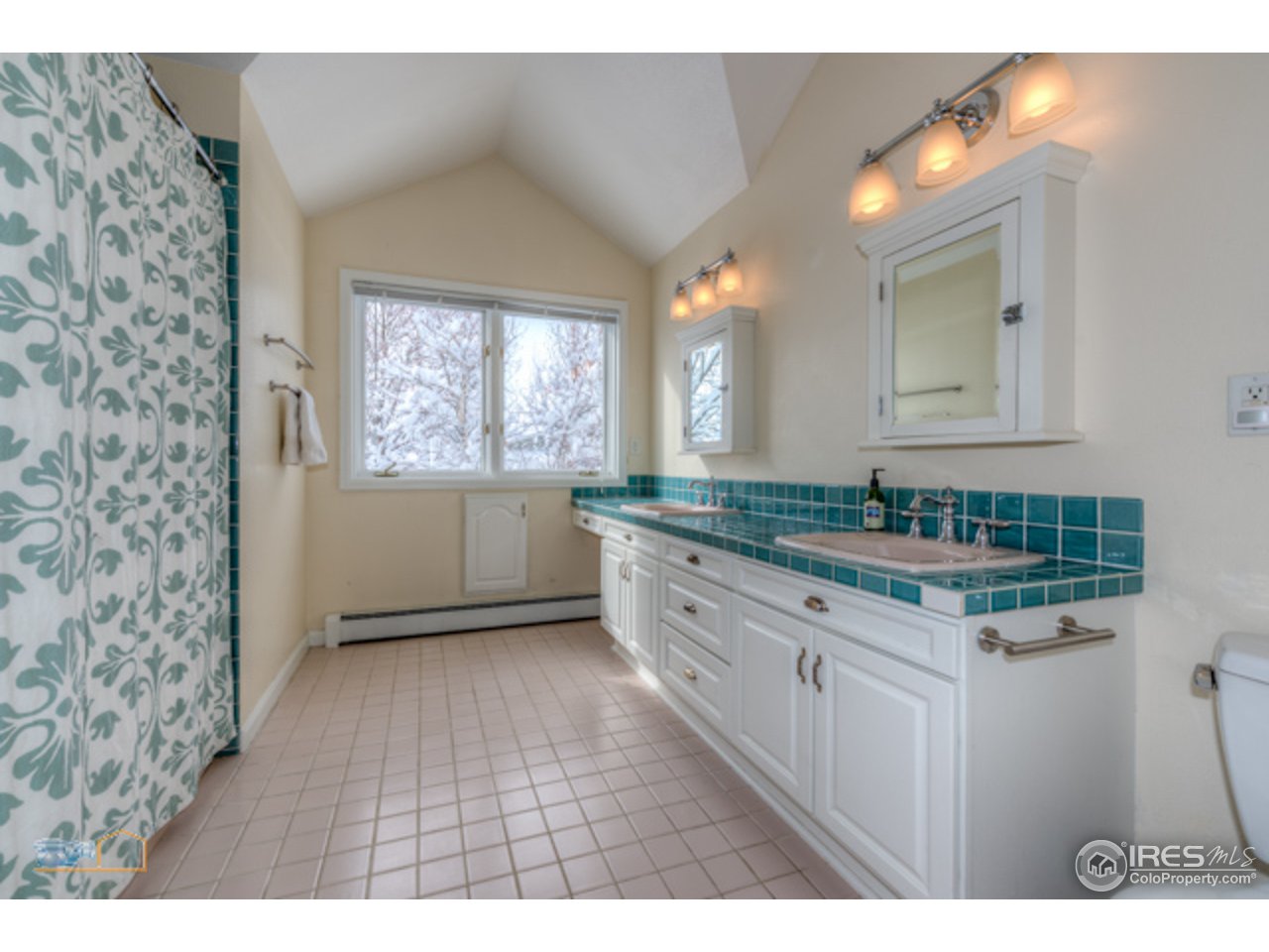 4669 Apple Way Boulder, CO 80301 - Photo 21 of 25 a kitchen with granite countertop a sink and cabinets