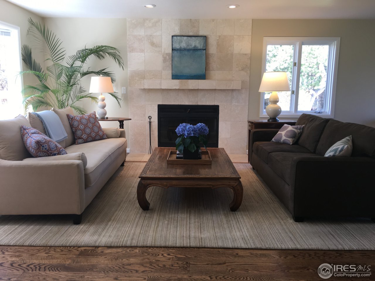 4669 Apple Way Boulder, CO 80301 - Photo 3 of 25 a living room with furniture and a fireplace