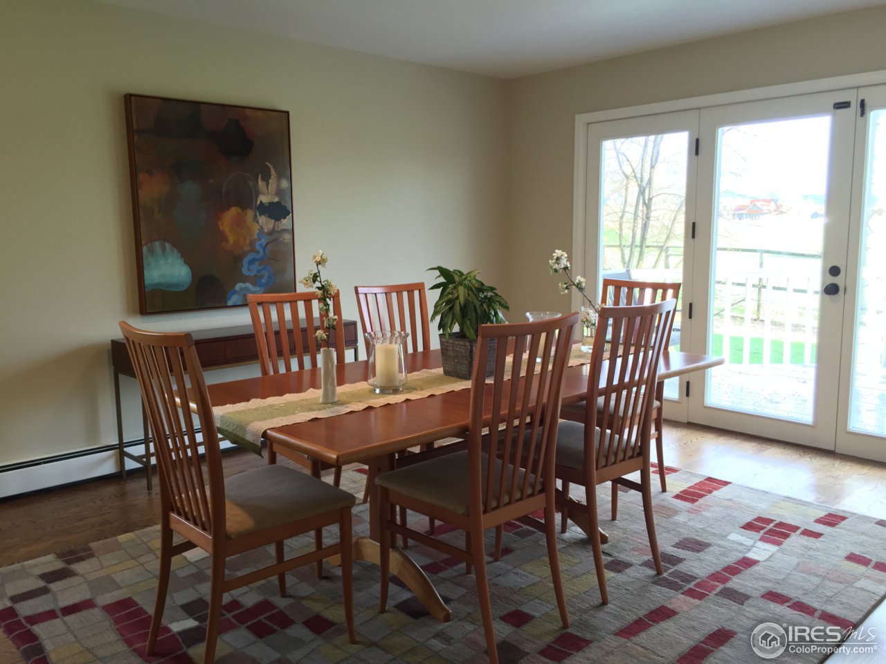 4669 Apple Way Boulder, CO 80301 - Photo 4 of 25 a view of a dining room with furniture and wooden floor