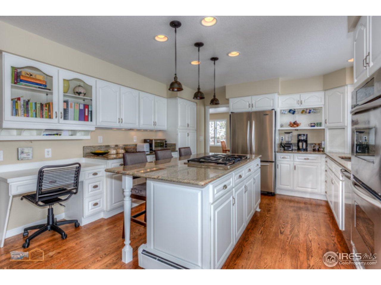 4669 Apple Way Boulder, CO 80301 - Photo 5 of 25 a kitchen with granite countertop a sink appliances and cabinets