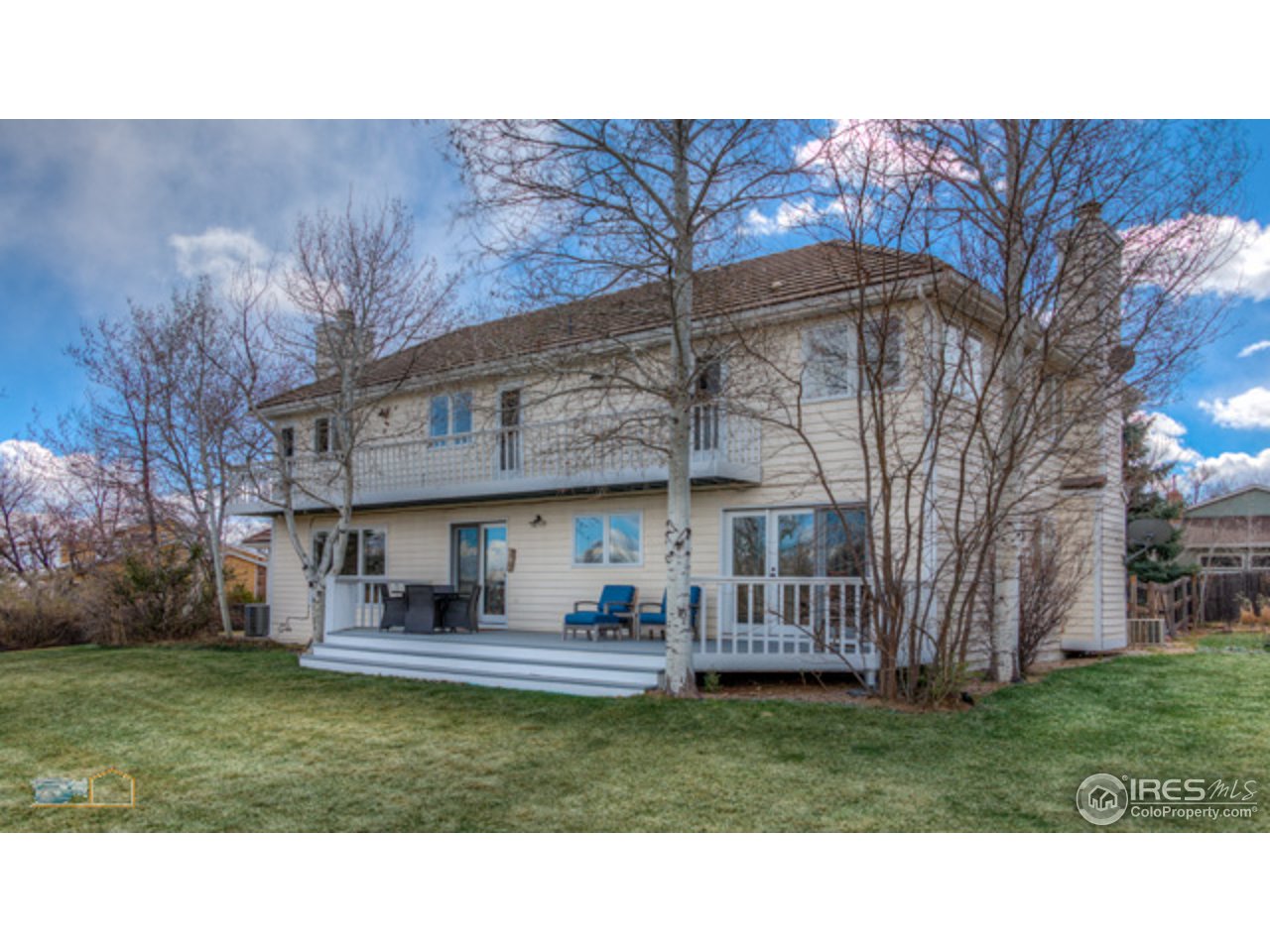 4669 Apple Way Boulder, CO 80301 - Photo 8 of 25 a black and white house with a big yard and large trees