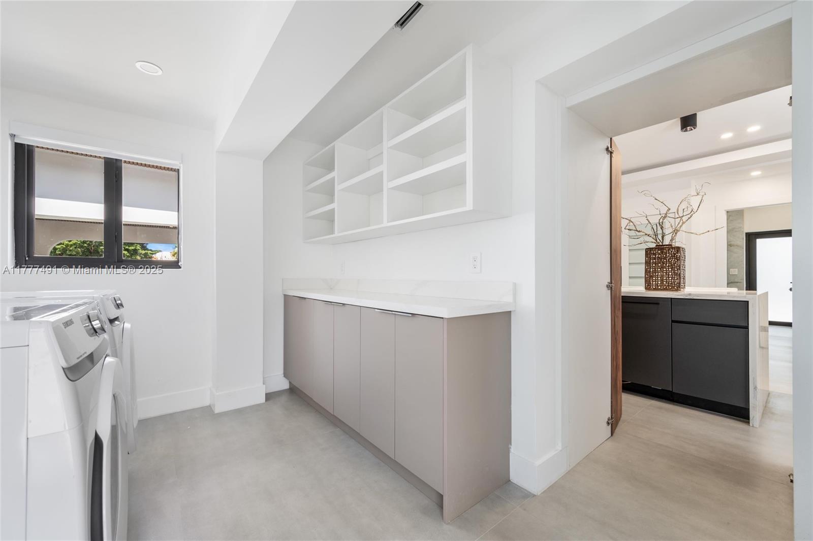 2268 Southwest 16th Terrace Miami, FL 33145 - Photo 14 of 34 a view of an empty room with a fireplace and a window