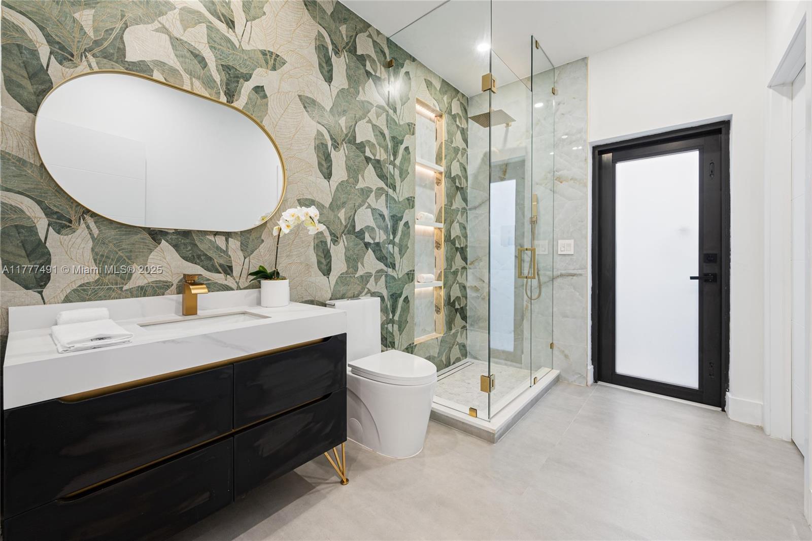 2268 Southwest 16th Terrace Miami, FL 33145 - Photo 20 of 34 a bathroom with a double vanity sink mirror and toilet