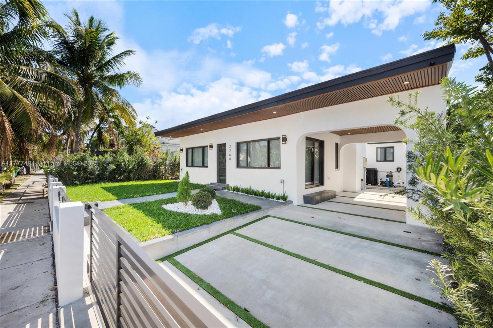 2268 Southwest 16th Terrace Miami, FL 33145 - Photo 2 of 34 a front view of house with yard and outdoor seating
