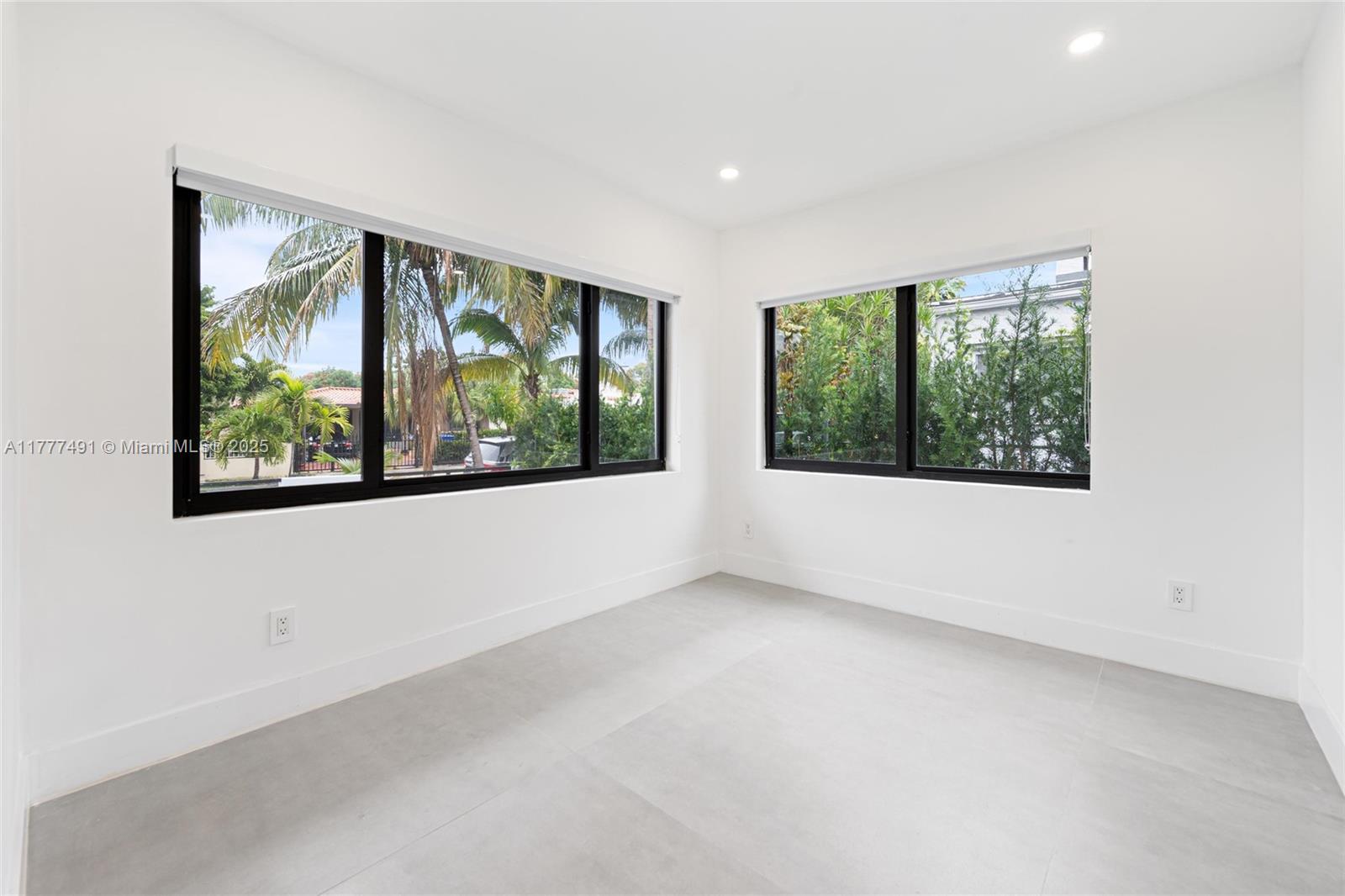 2268 Southwest 16th Terrace Miami, FL 33145 - Photo 21 of 34 an empty room with large windows