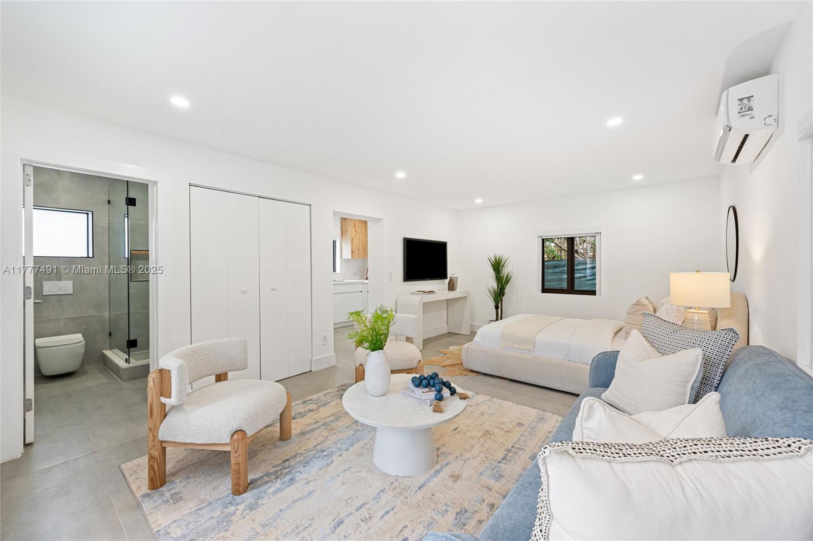 2268 Southwest 16th Terrace Miami, FL 33145 - Photo 26 of 34 a living room with furniture and a flat screen tv