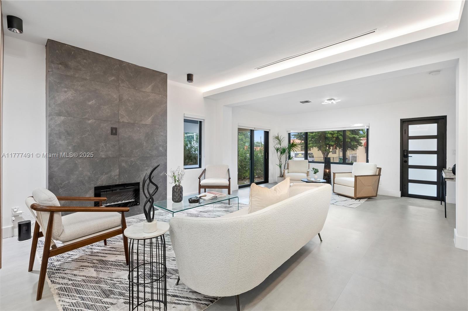 2268 Southwest 16th Terrace Miami, FL 33145 - Photo 8 of 34 a living room with furniture and a fireplace