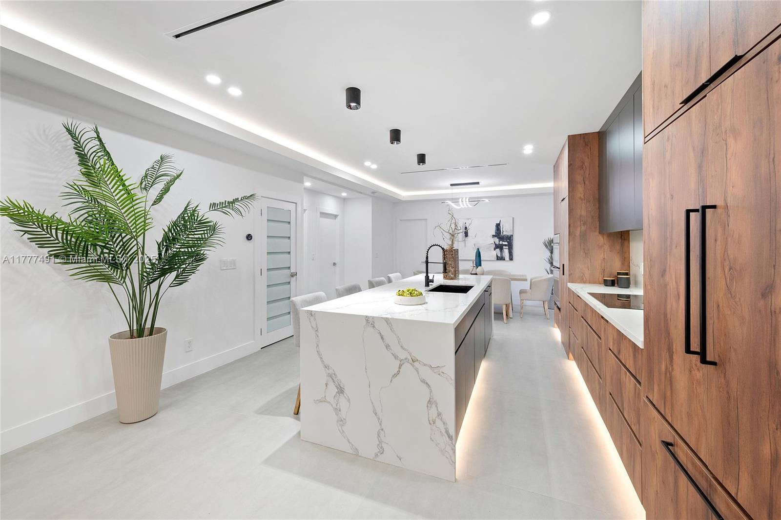 2268 Southwest 16th Terrace Miami, FL 33145 - Photo 10 of 34 a large white kitchen with a large window