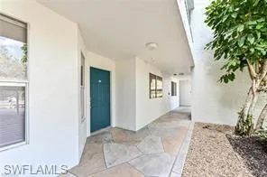 a view of a hallway with entryway in front of a house