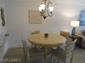 a kitchen with stainless steel appliances a refrigerator and wooden floor
