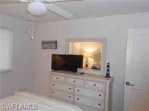 a bedroom with a bed and a night stand