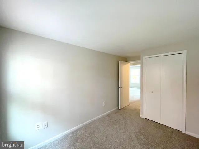 a view of an empty room and a window