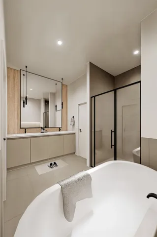 a bedroom with furniture and a large window