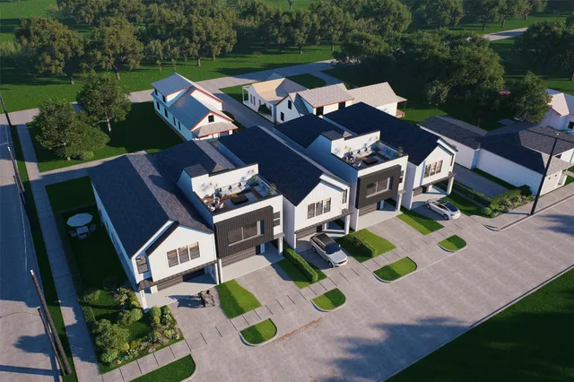 an aerial view of a house with backyard