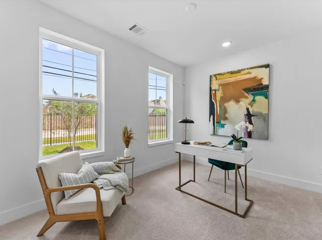 a workspace with furniture and a window