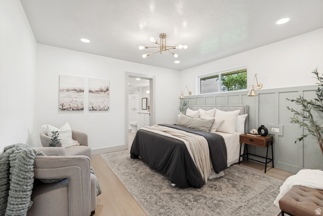 1010 West Maple Street Mapleton, UT 84664 - Photo 11 of 24 Spacious bedroom featuring light wood-finish flooring, recessed lighting, and a modern chandelier