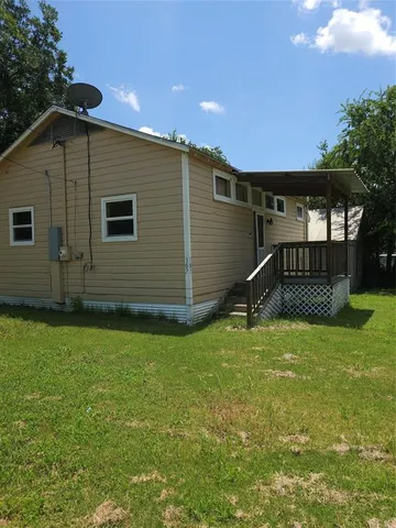a backyard of a house with lots of green space