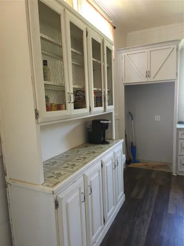 a kitchen with a sink and cabinets