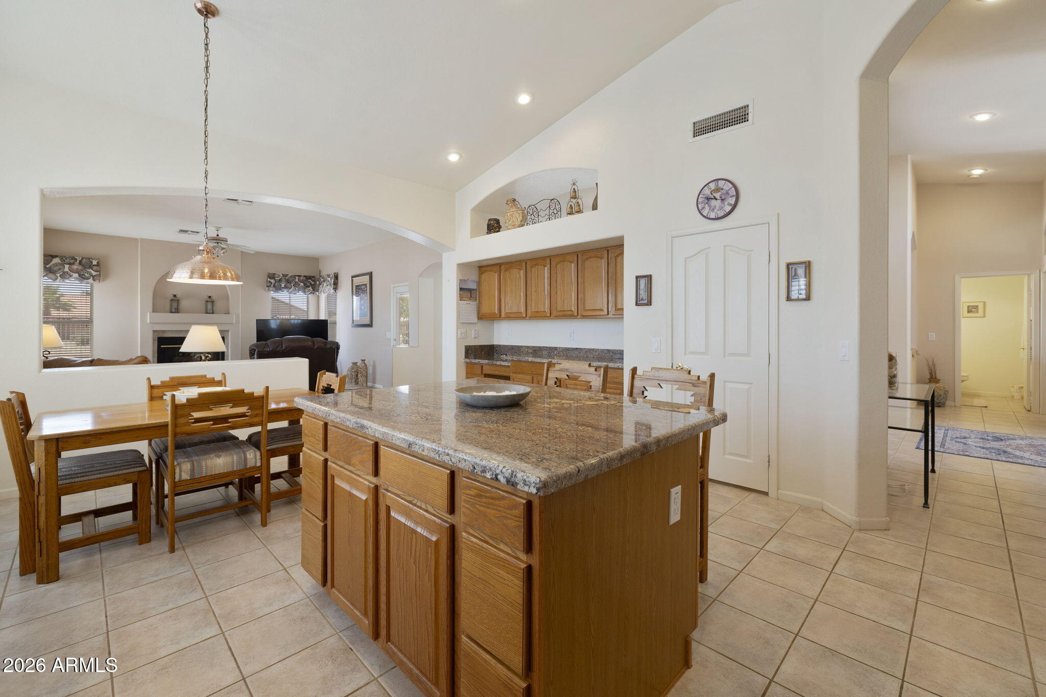 12435 West Monte Vista Road Avondale, AZ 85392 - Photo 19 of 69 a kitchen with stainless steel appliances granite countertop a sink and a refrigerator