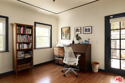 a work room with furniture and a window