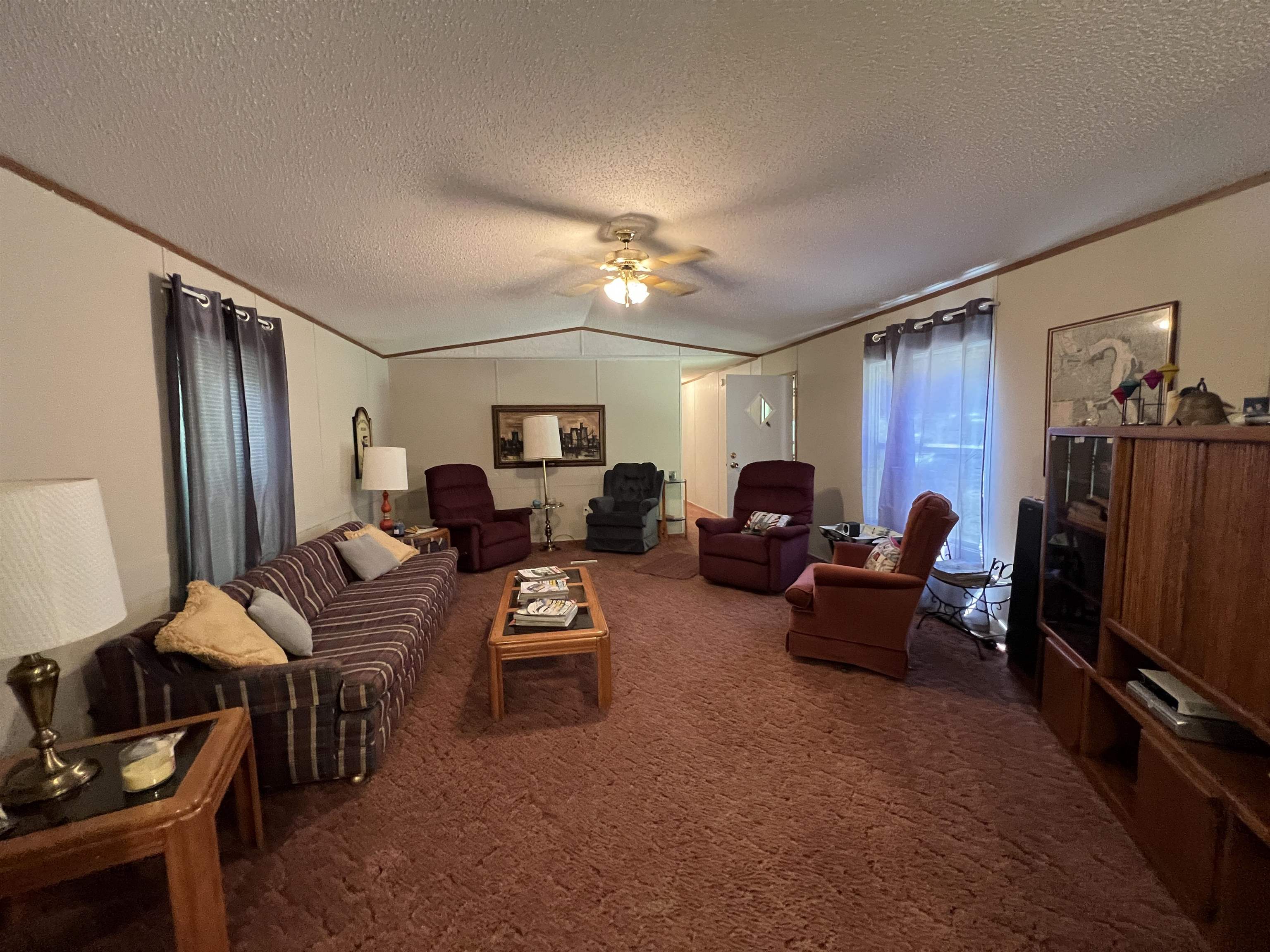 265 Cardinal Road Counce, TN 38326 - Photo 3 of 13 a living room with furniture a ceiling fan and a window