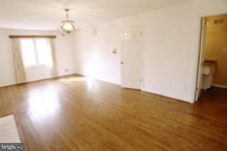 21815 Woodfield Road Gaithersburg, MD 20882 - Photo 14 of 29 Hardwood floor and hanging light fixture!
