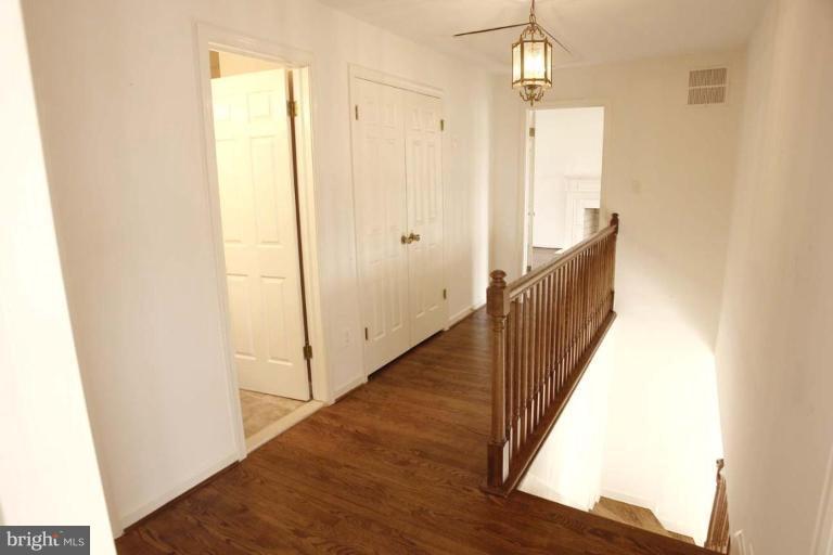 21815 Woodfield Road Gaithersburg, MD 20882 - Photo 8 of 29 Upstair hallway has hardwood floor!