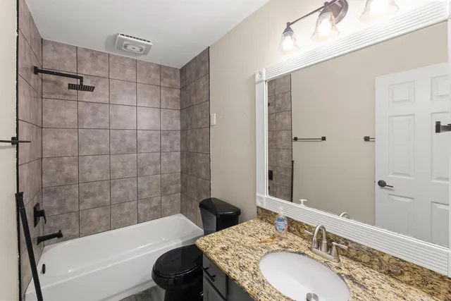 a view of a house with a backyard