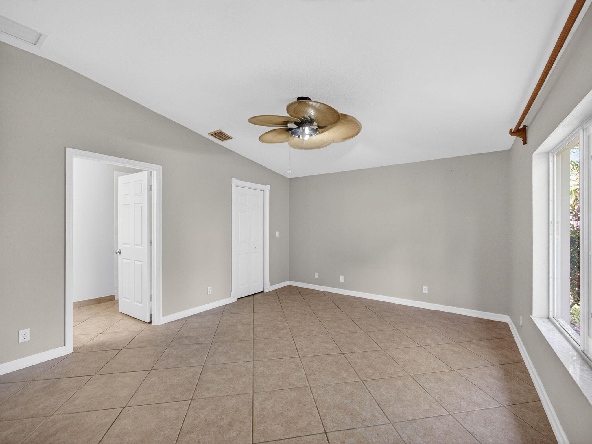 4358 Southeast Graham Drive Stuart, FL 34997 - Photo 15 of 38 a view of an empty room with a window