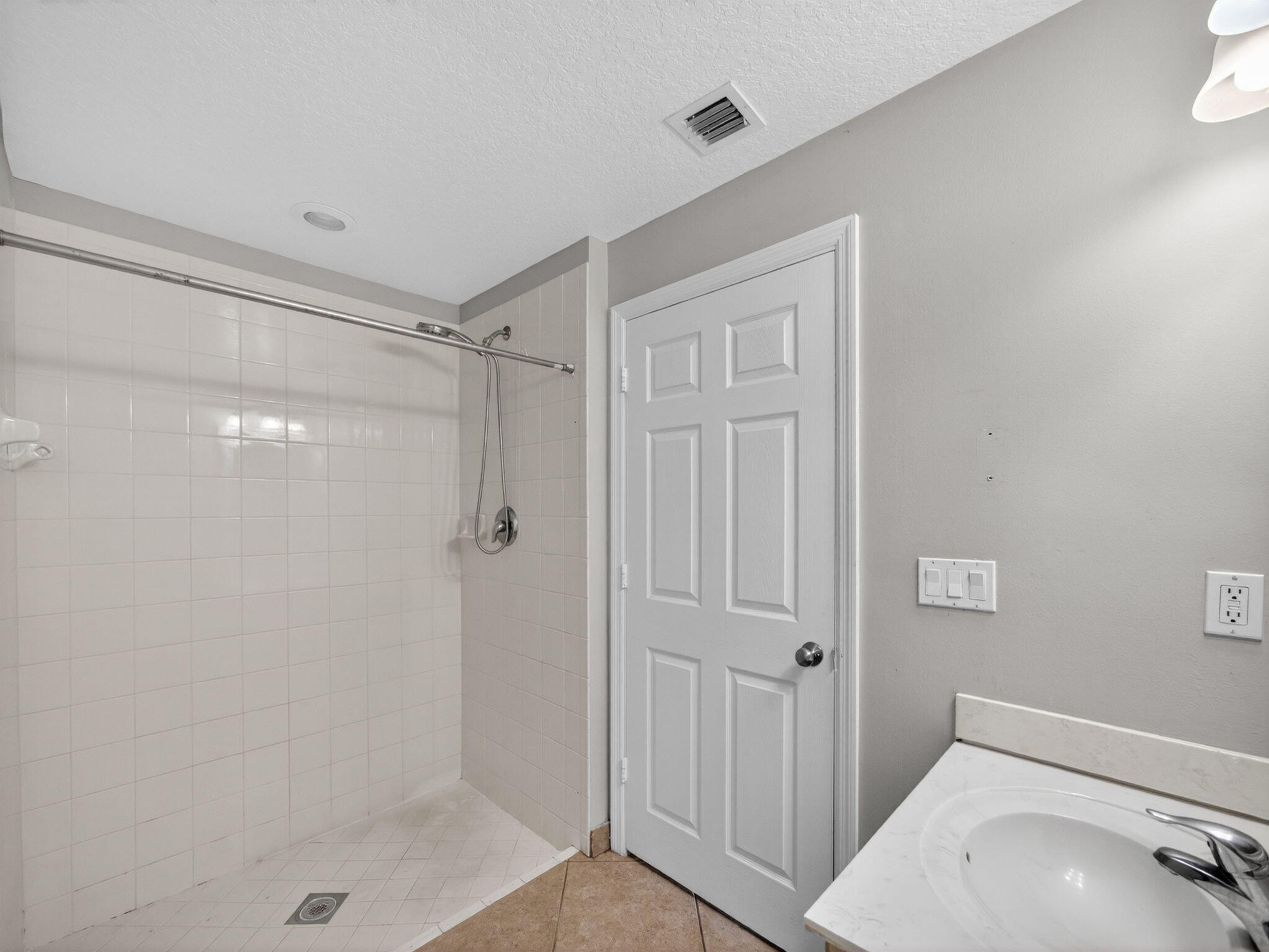 4358 Southeast Graham Drive Stuart, FL 34997 - Photo 19 of 38 a bathroom with a shower and a sink