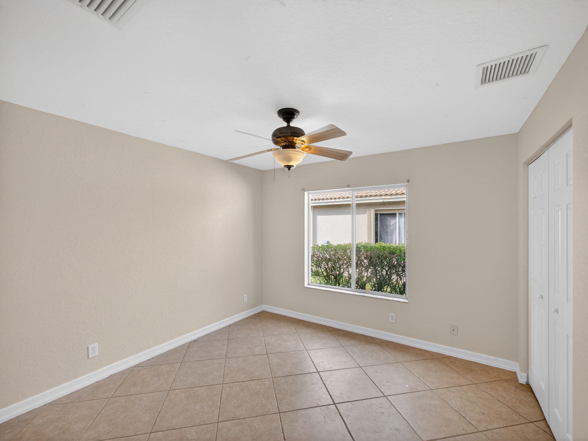 4358 Southeast Graham Drive Stuart, FL 34997 - Photo 23 of 38 a view of an empty room with a window