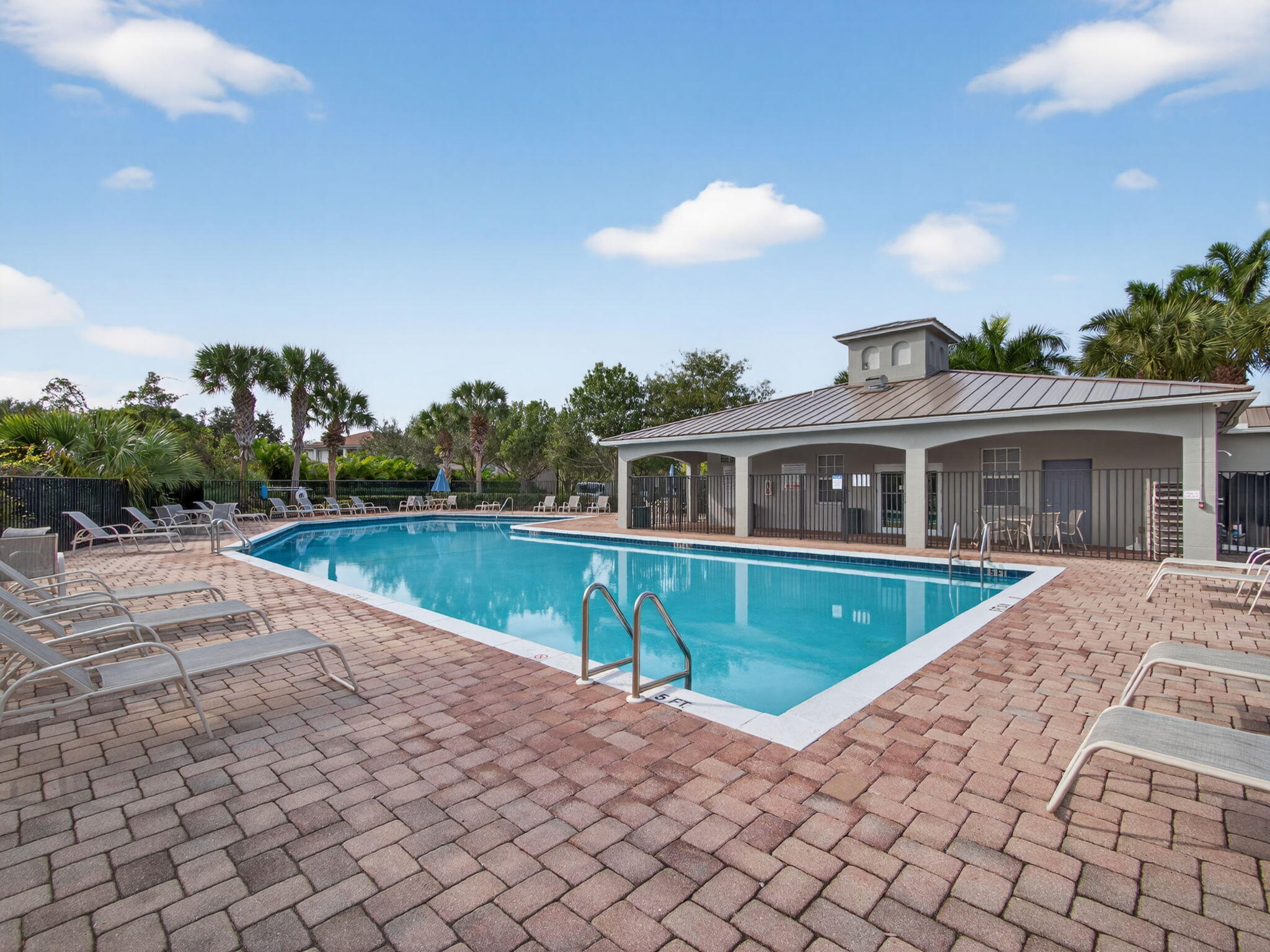 4358 Southeast Graham Drive Stuart, FL 34997 - Photo 34 of 38 a front view of house with yard and outdoor seating
