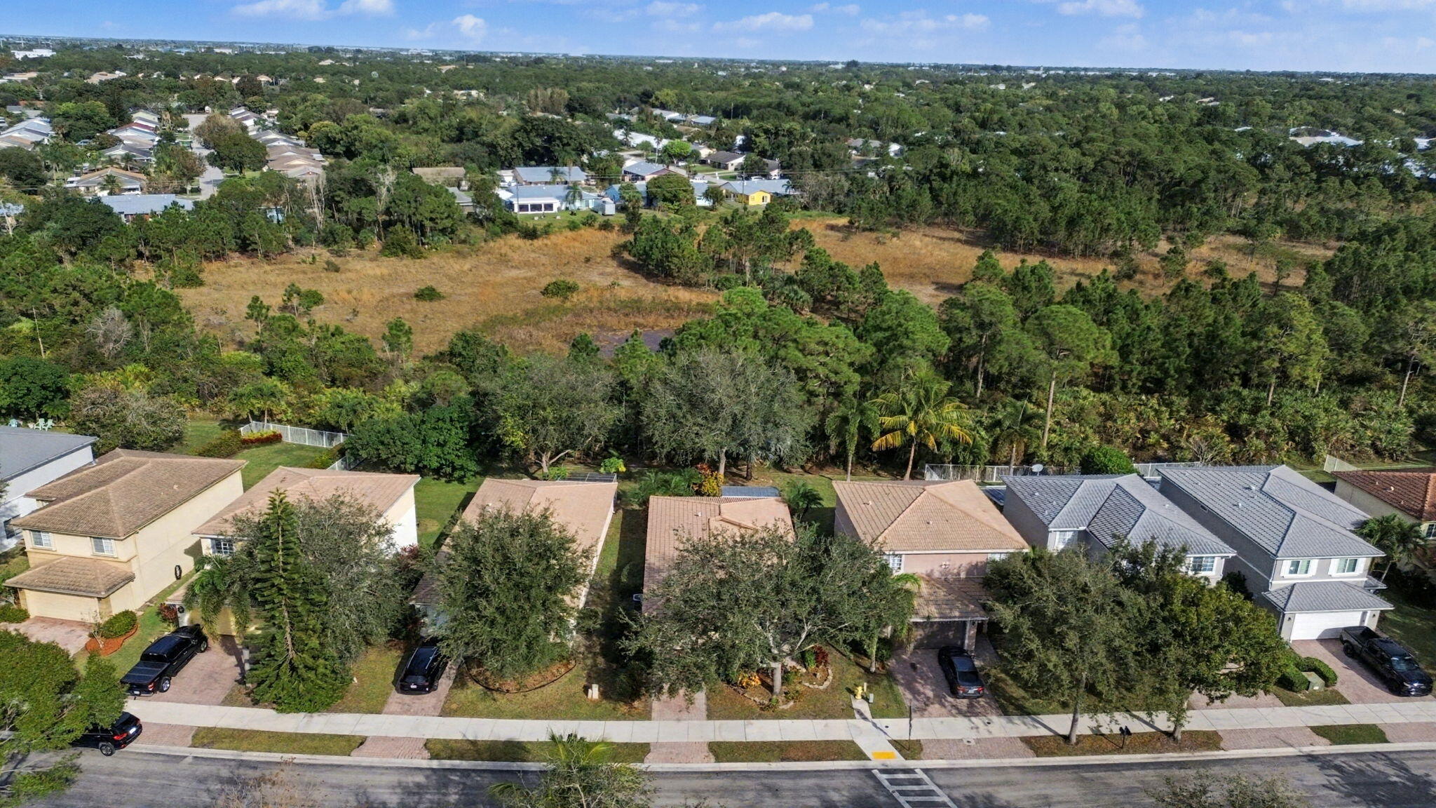 4358 Southeast Graham Drive Stuart, FL 34997 - Photo 4 of 38 an aerial view of residential houses with outdoor space and trees