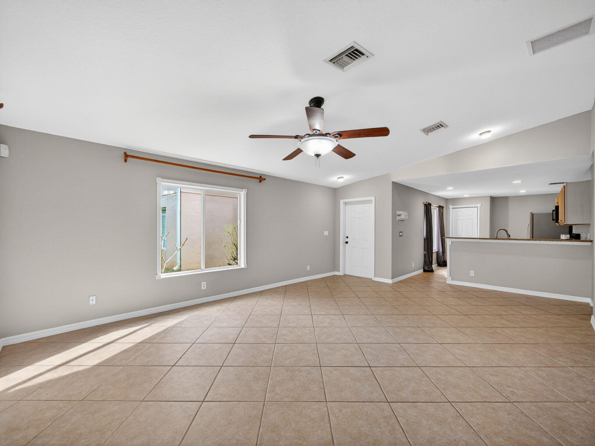 4358 Southeast Graham Drive Stuart, FL 34997 - Photo 9 of 38 a view of an empty room with a window