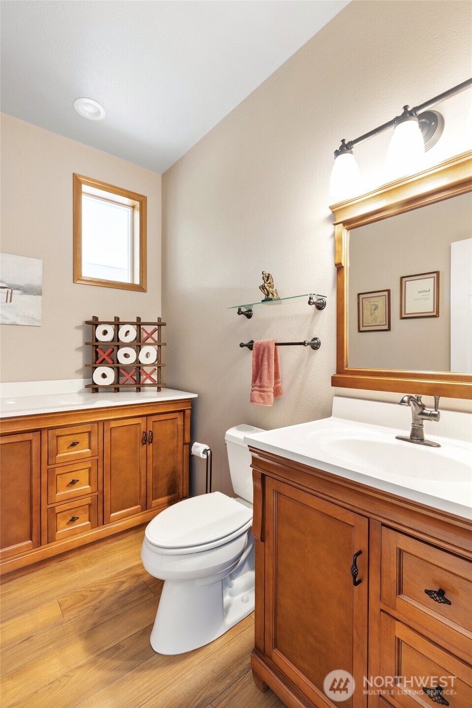 14419 Martinson Road Southeast Yelm, WA 98597 - Photo 17 of 39 a bathroom with a sink toilet vanity and window