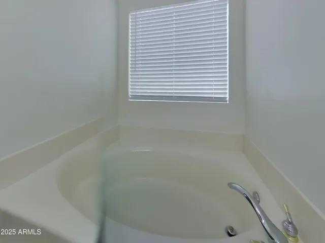a close up of a bathtub in a bathroom