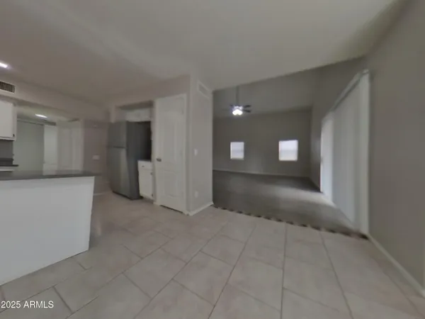 a view of empty room with a fireplace