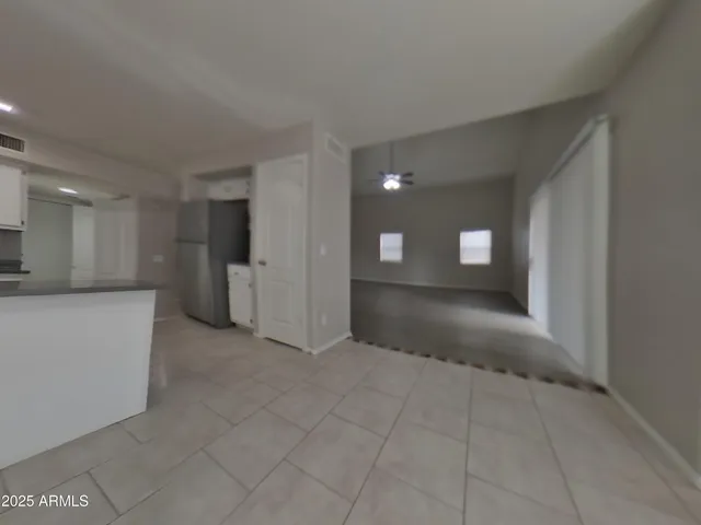 a view of empty room with a fireplace