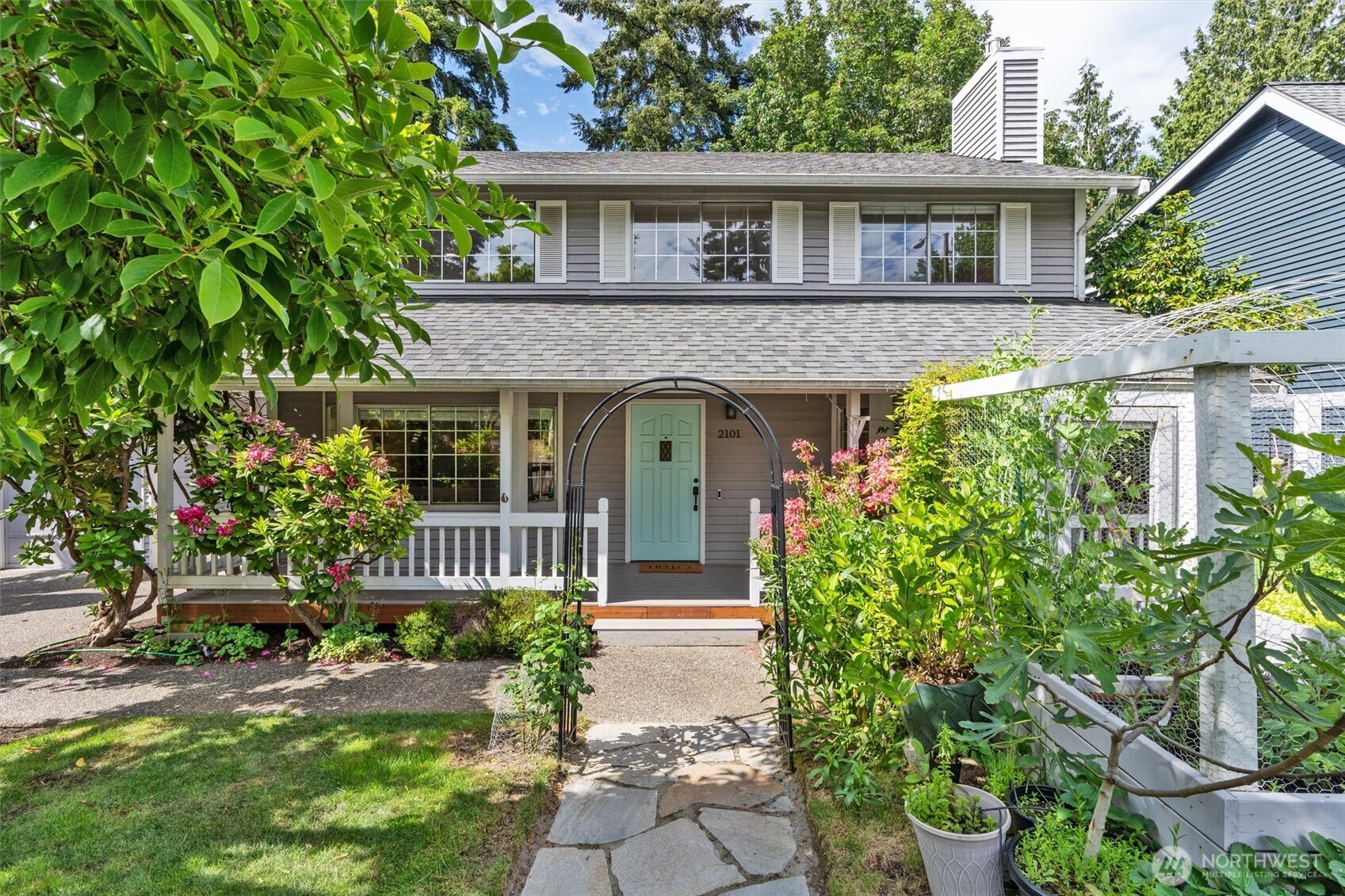 2101 233rd Street Southeast Bothell, WA 98021 - Photo 1 of 40 a front view of a house with a garden