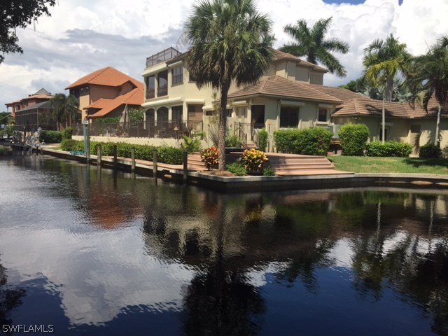 13200 Linton Road Fort Myers, FL 33908 - Photo 1 of 10 a view of residential houses with lake view and lake view