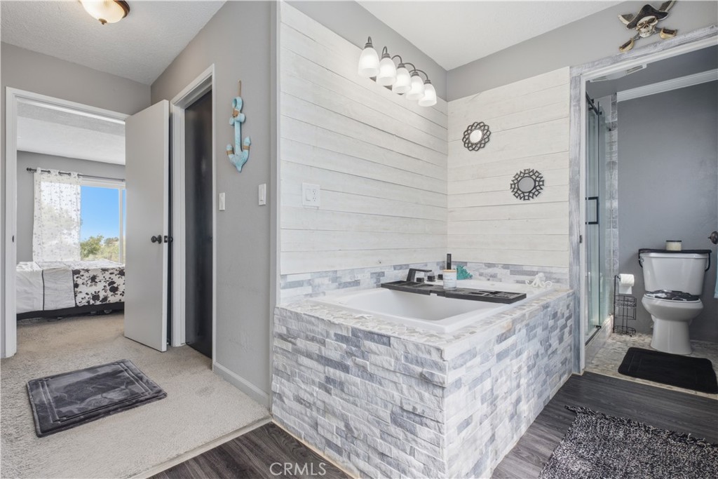 26201 Cumberland Road Tehachapi, CA 93561 - Photo 22 of 36 a spacious bathroom with a sink and a mirror