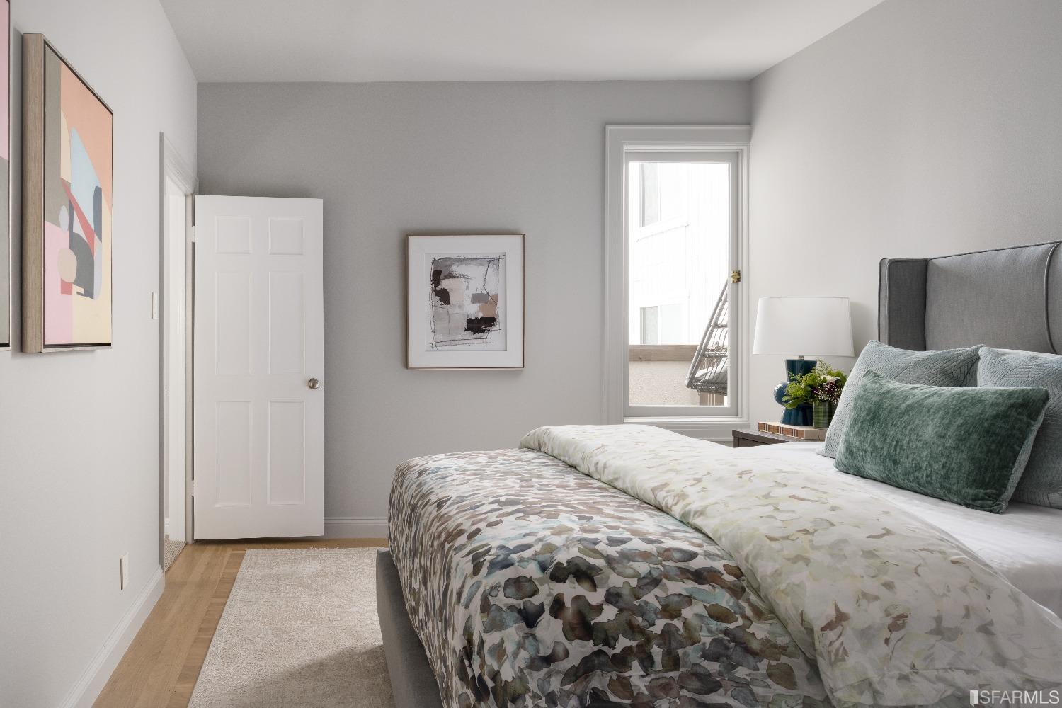 3007 Jackson Street San Francisco, CA 94115 - Photo 17 of 30 a bedroom with a large bed and a window