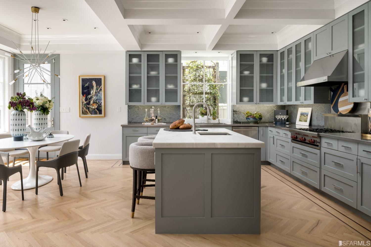 3007 Jackson Street San Francisco, CA 94115 - Photo 6 of 30 a kitchen with a stove a sink a dining table and chairs