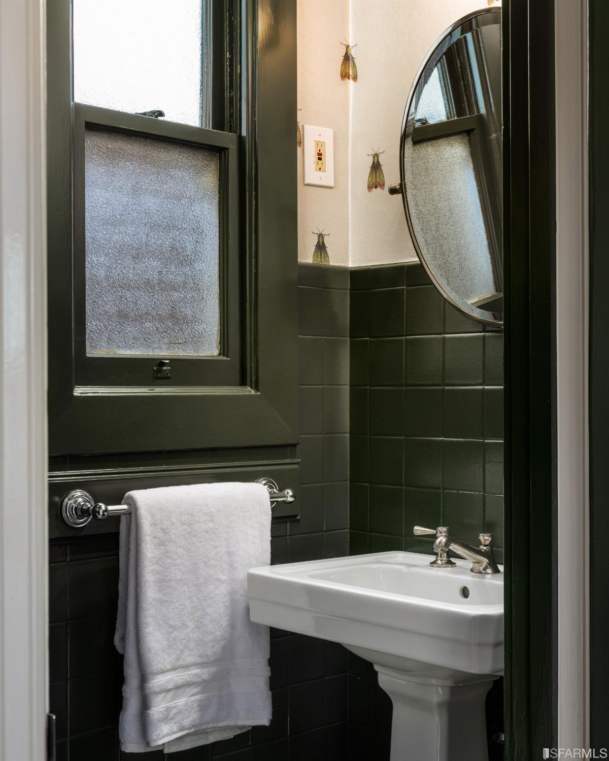 3007 Jackson Street San Francisco, CA 94115 - Photo 9 of 30 a bathroom with a sink a toilet and mirror