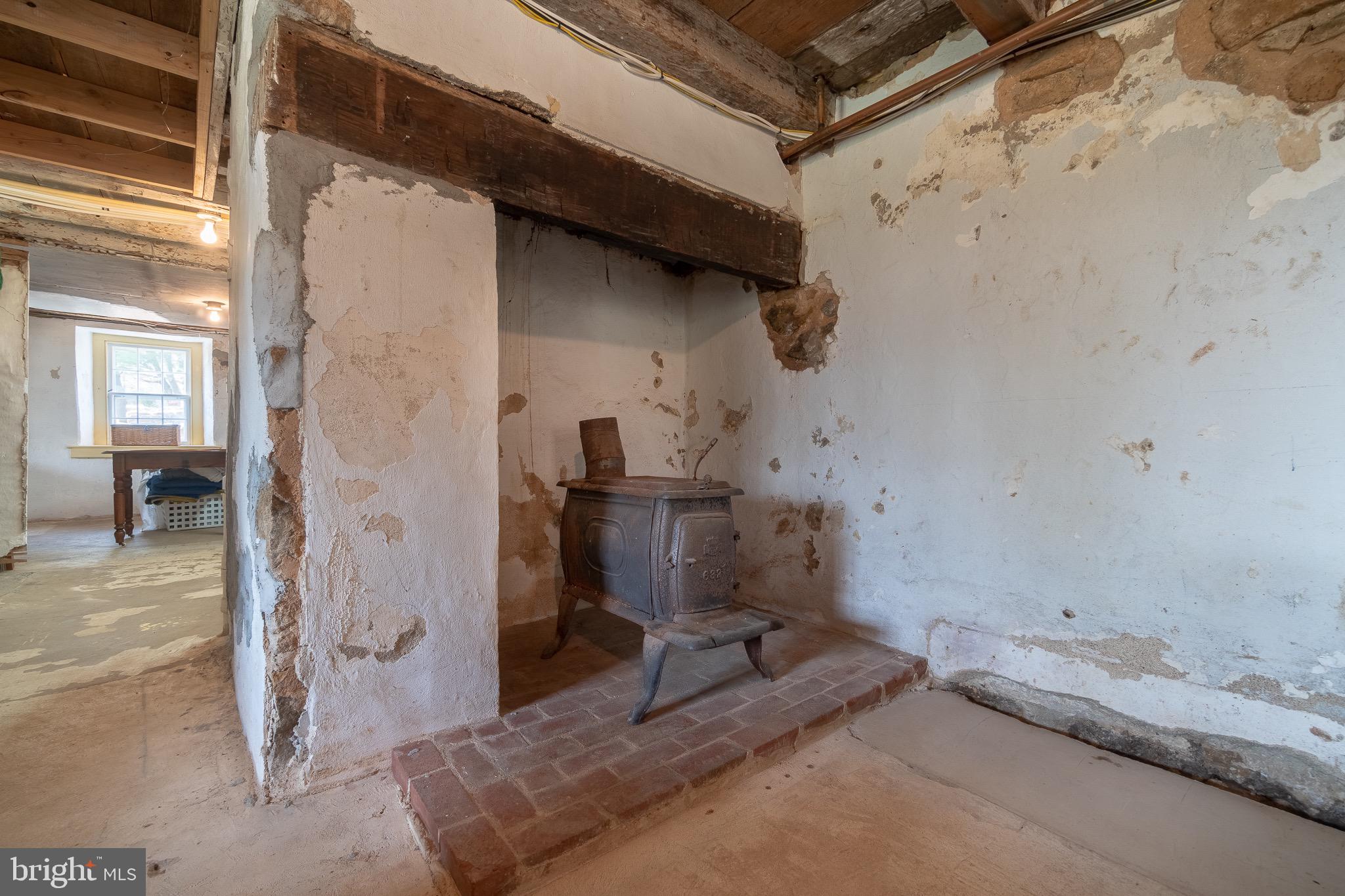 166 Warwick Road Elverson, PA 19520 - Photo 23 of 28 Basement Fireplace