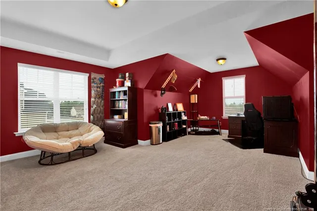a view of a livingroom with furniture and a flat screen tv
