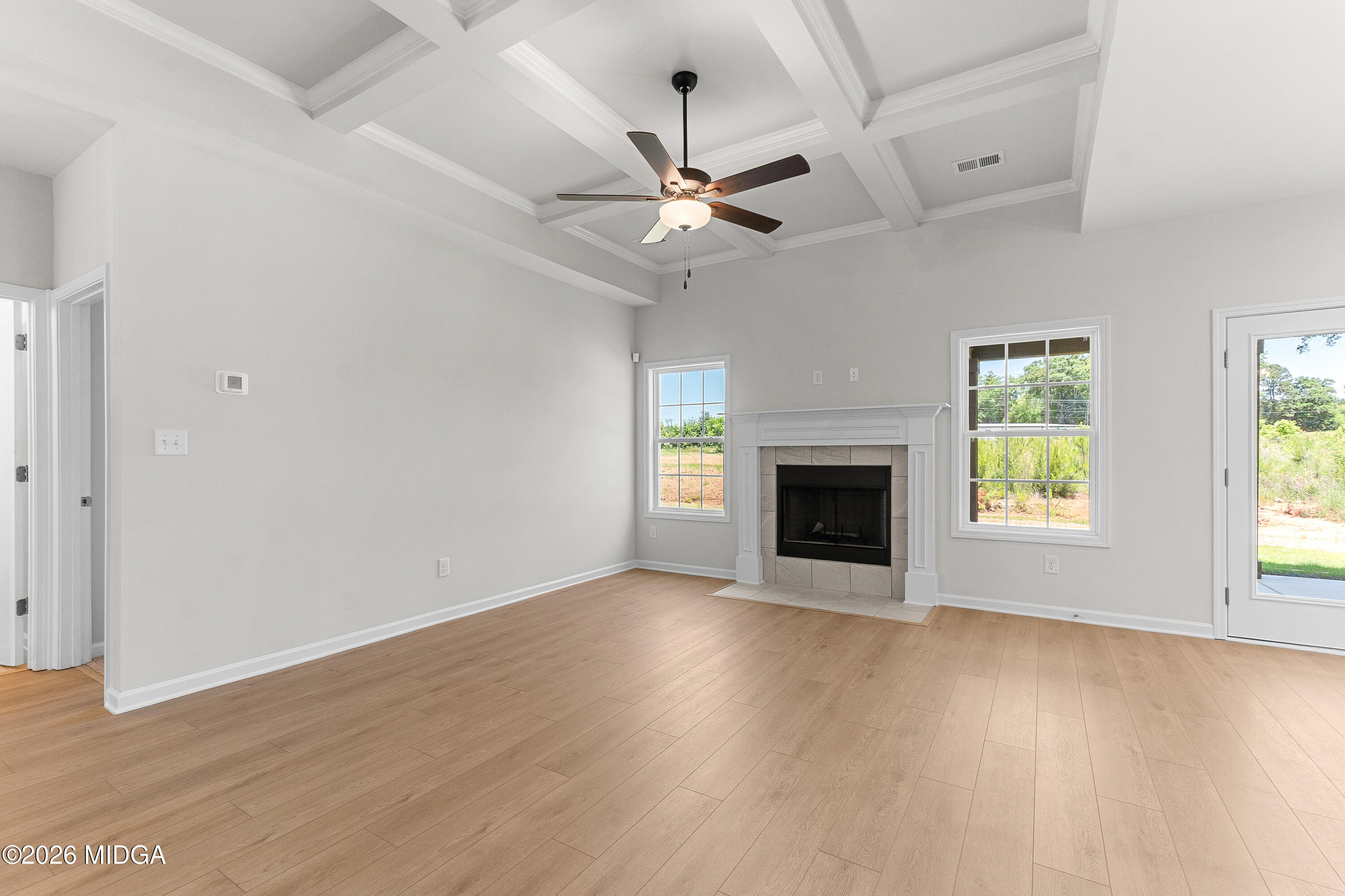 5393 Felles Way, Unit 359 Forsyth, GA 31029 - Photo 23 of 54 an empty room with windows and a fireplace