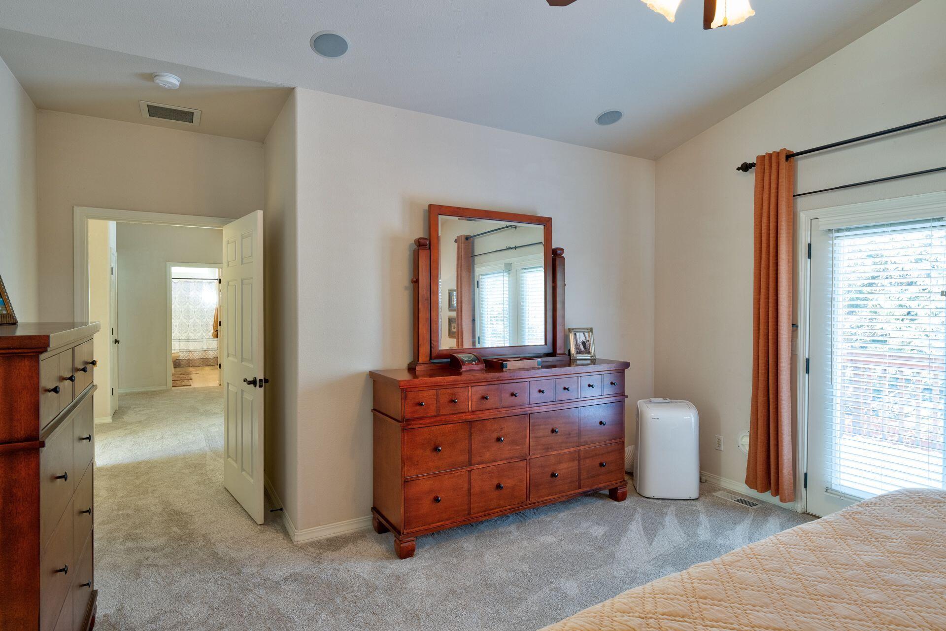 3335 Northeast Stonebrook Loop Bend, OR 97701 - Photo 22 of 29 a room with a bed and a dresser
