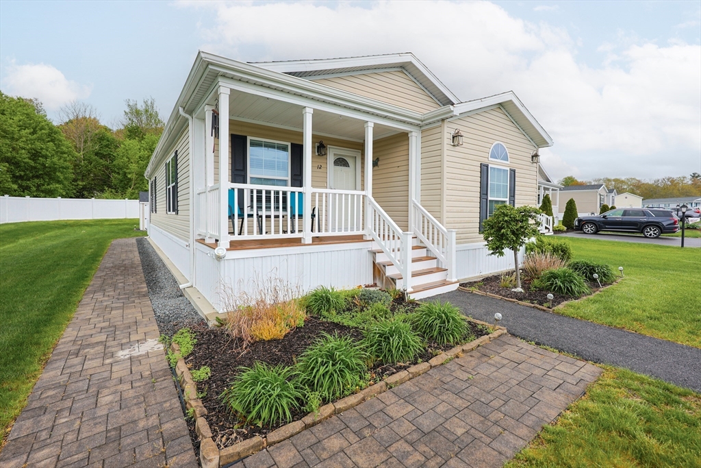 12 Linsay Drive Raynham, MA 02767 - Photo 1 of 28 front view of a house with a yard